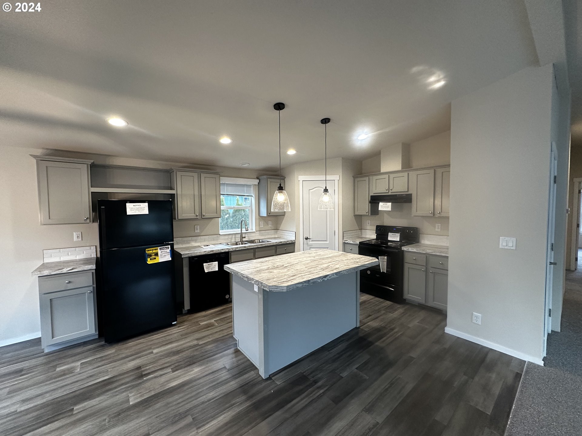 644 Main Street Yoncalla, OR 97499 - Photo 11 of 29 a kitchen with kitchen island sink stove and refrigerator