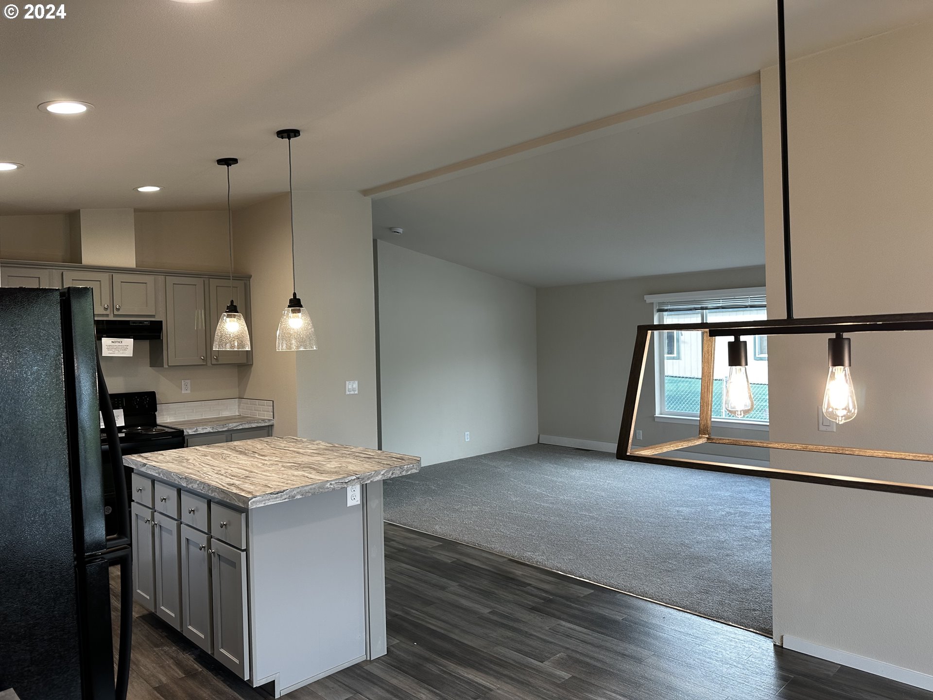 644 Main Street Yoncalla, OR 97499 - Photo 14 of 29 a kitchen with a sink microwave and cabinets