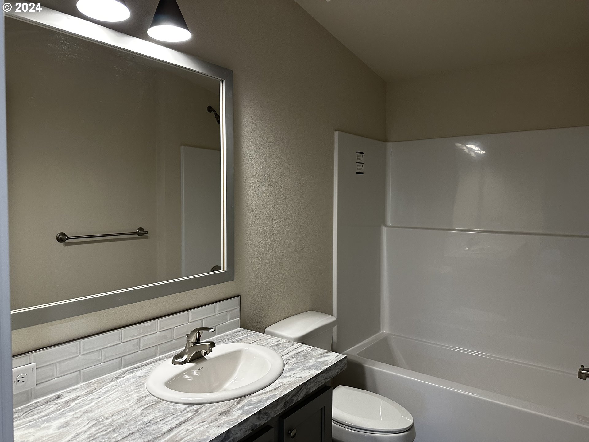 644 Main Street Yoncalla, OR 97499 - Photo 17 of 29 a bathroom with a sink toilet and shower