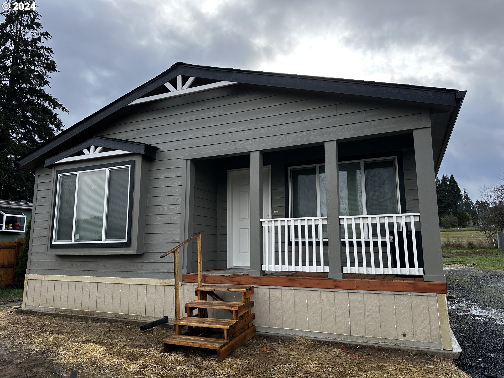 644 Main Street Yoncalla, OR 97499 - Photo 2 of 29 a view of a house with a deck and a yard