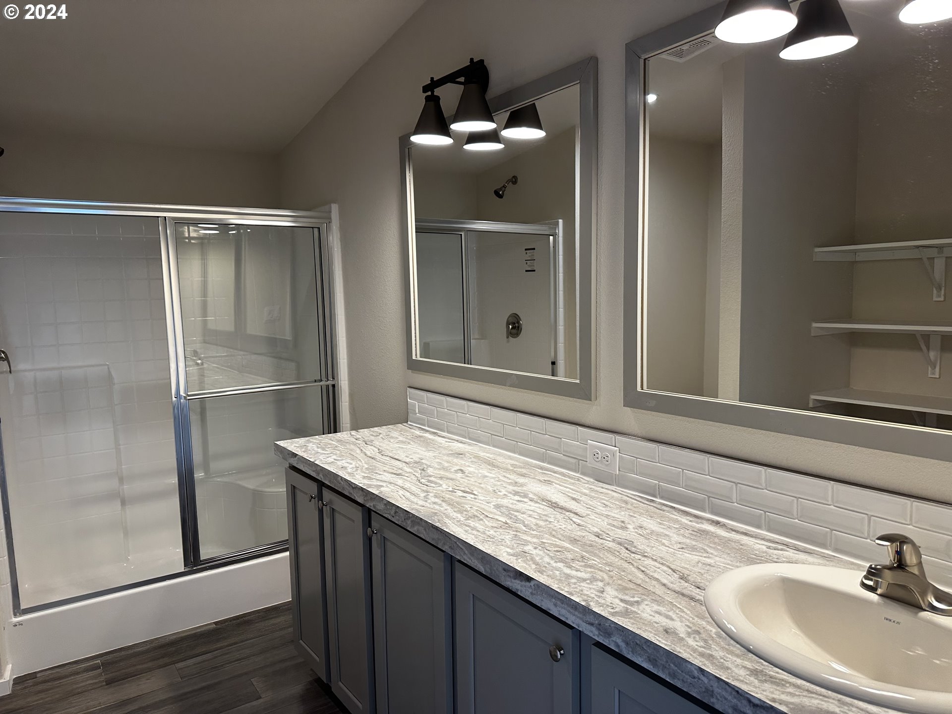 644 Main Street Yoncalla, OR 97499 - Photo 24 of 29 a bathroom with a sink and a mirror