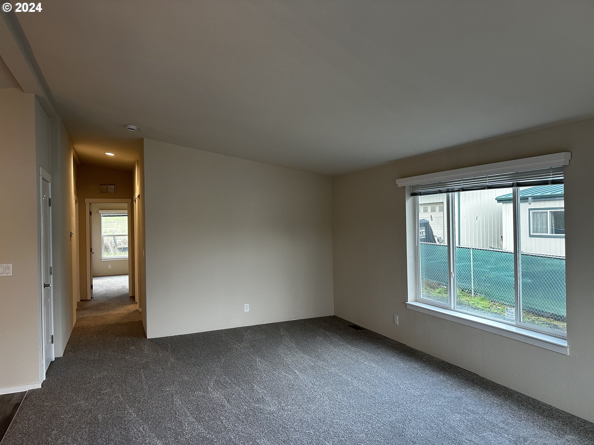 644 Main Street Yoncalla, OR 97499 - Photo 4 of 29 an empty room with a window