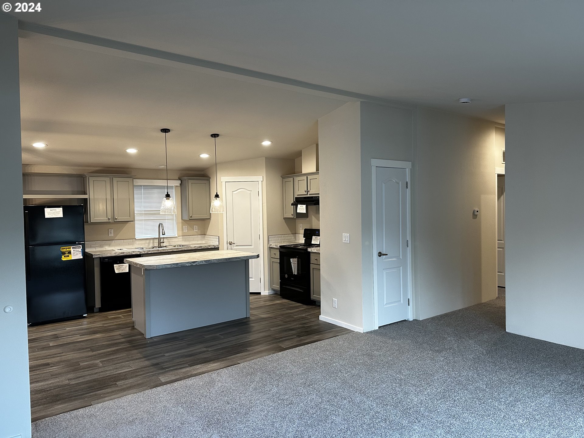 644 Main Street Yoncalla, OR 97499 - Photo 6 of 29 a large kitchen with a large counter top appliances and cabinets