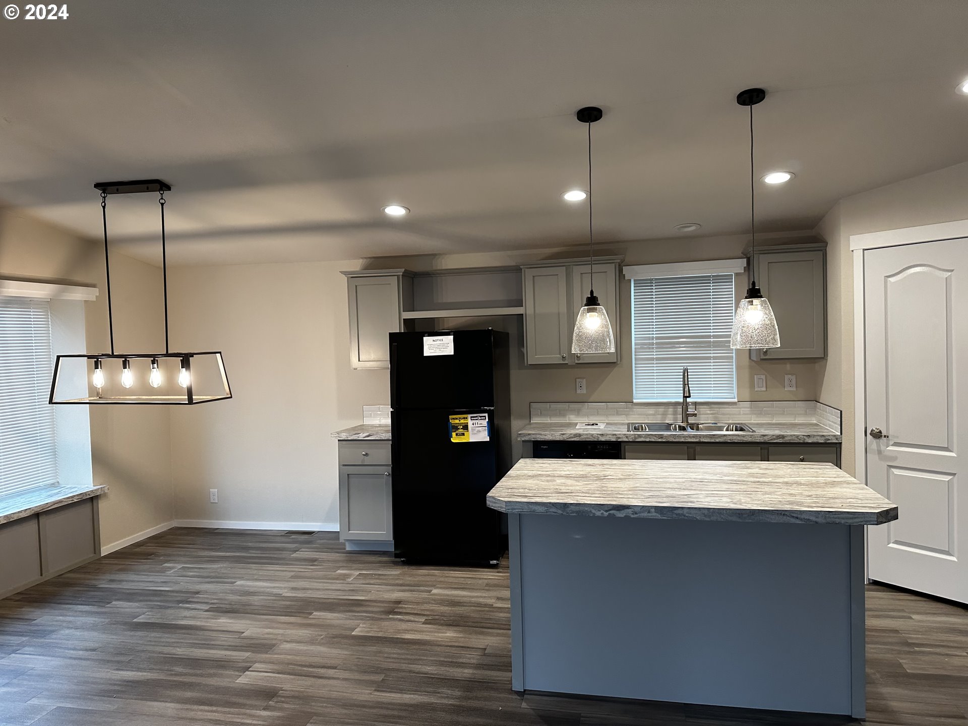 644 Main Street Yoncalla, OR 97499 - Photo 8 of 29 a view of a kitchen with a sink and refrigerator