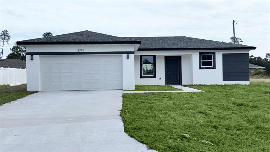 2796 Southwest 164th Road Ocala, FL 34473 - Photo 1 of 1 a front view of a house with garden