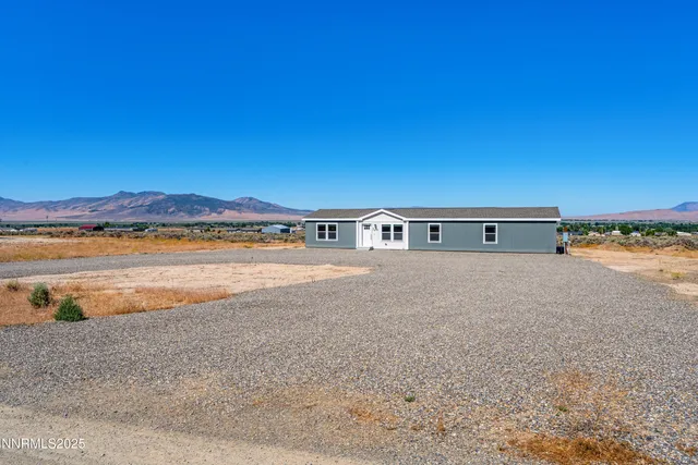 a view of house with ocean view