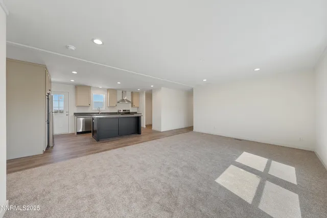 a view of a kitchen with a sink and white cabinets