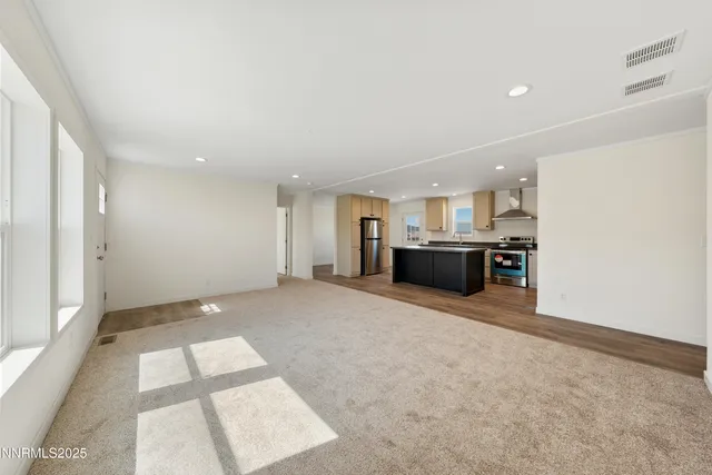 a view of kitchen and refrigerator