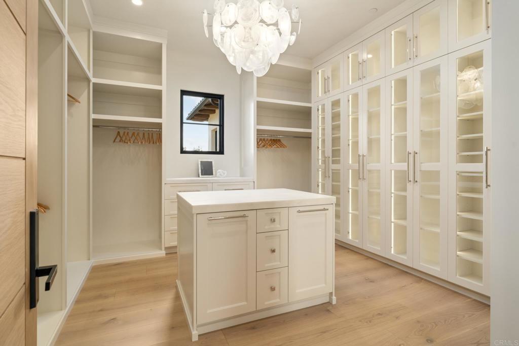16345 Los Arboles Rancho Santa Fe, CA 92067 - Photo 13 of 17 an entryway with a cabinet and a mirror