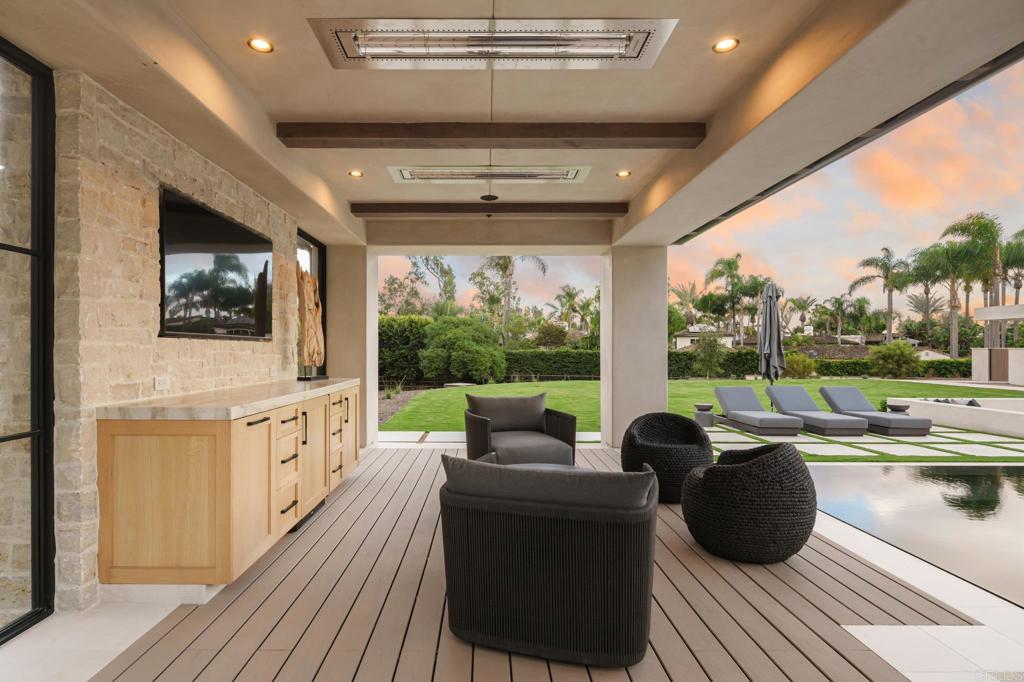 16345 Los Arboles Rancho Santa Fe, CA 92067 - Photo 15 of 17 a living room with patio furniture and a flat screen tv