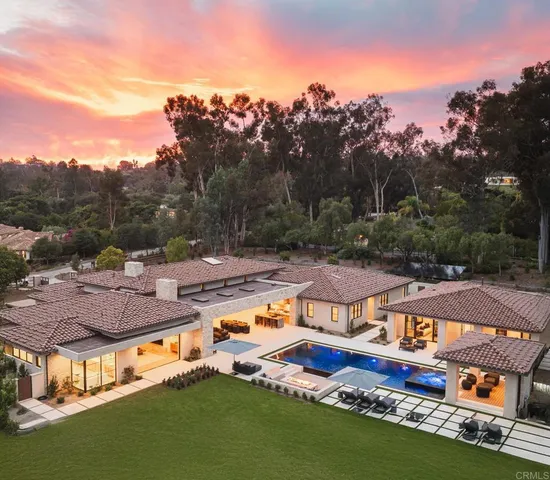 an aerial view of a house with swimming pool yard and outdoor seating