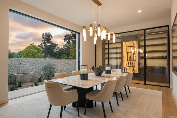 a view of a dining room with furniture window and outside view