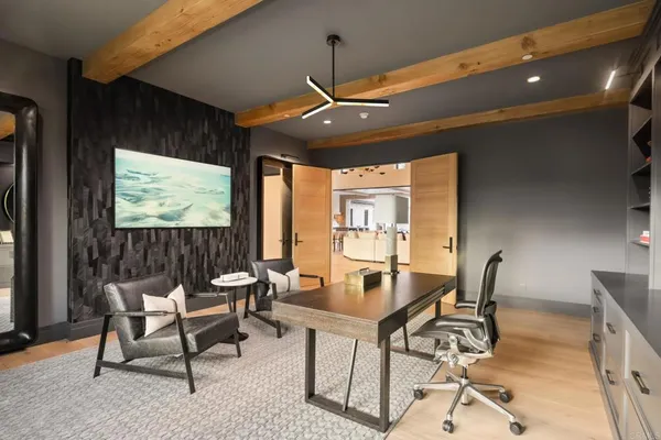 a dining room with furniture and window