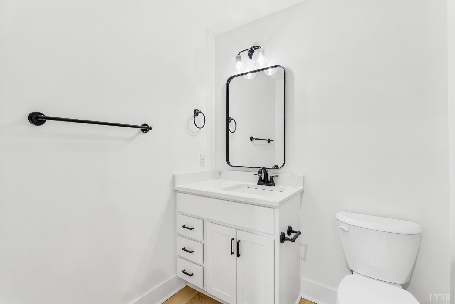 556 Leesville Road, Unit 406 Lynchburg, VA 24502 - Photo 25 of 39 a bathroom with a toilet sink and mirror
