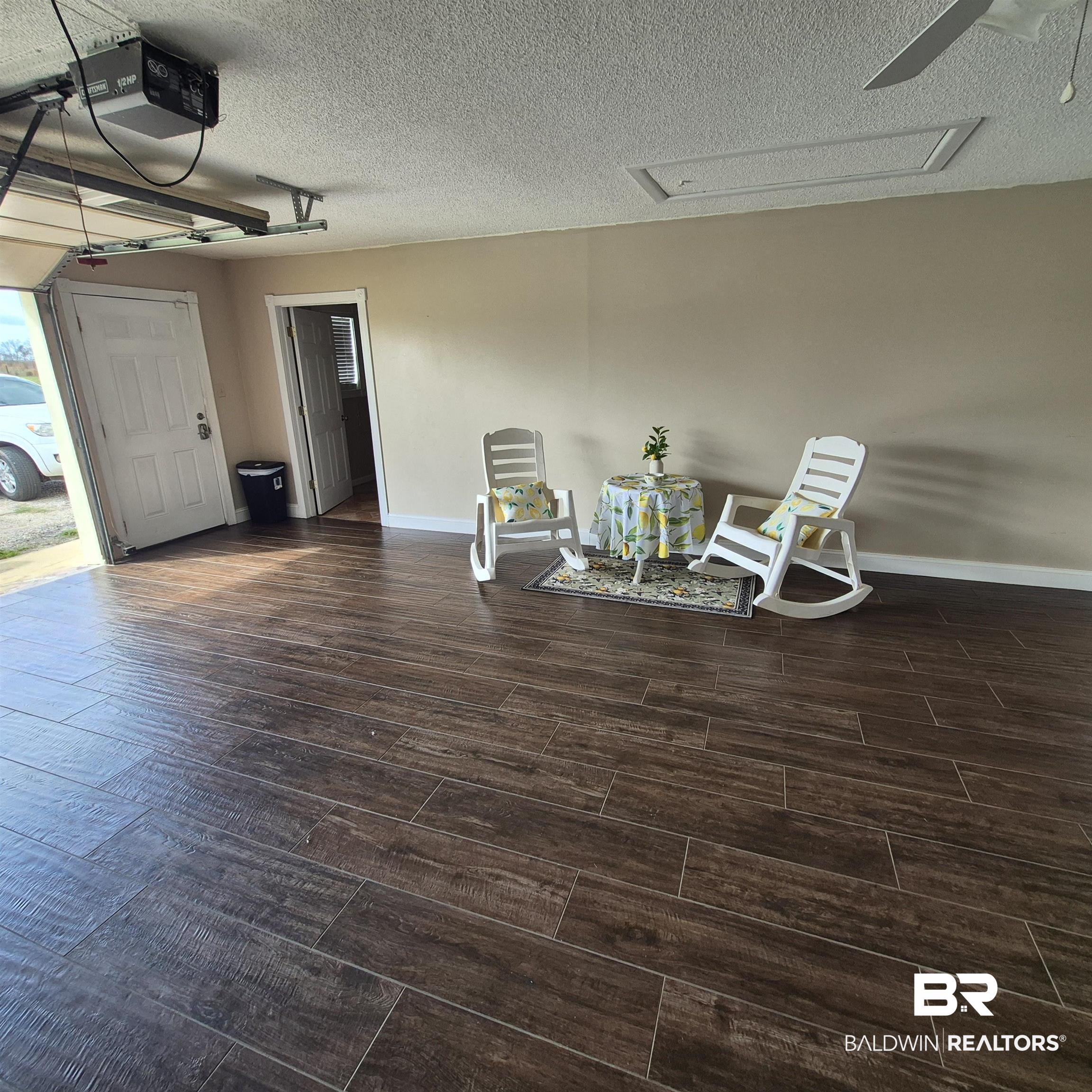26635 Highway 41 Range, AL 36473 - Photo 6 of 74 Living area featuring wood tiled floors and a textured ceiling