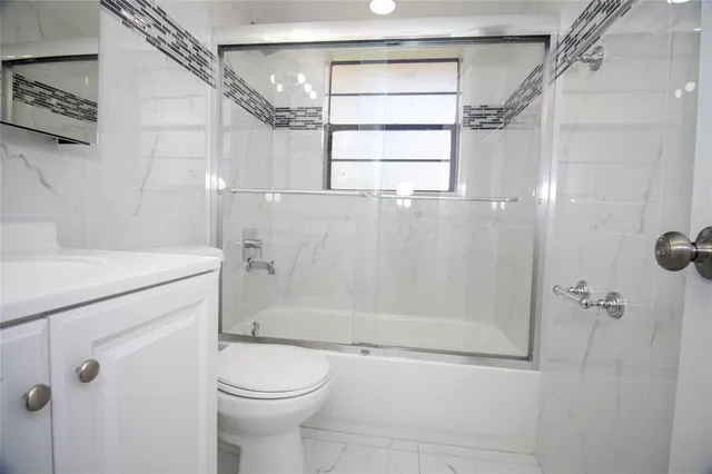 a kitchen with a sink and a refrigerator