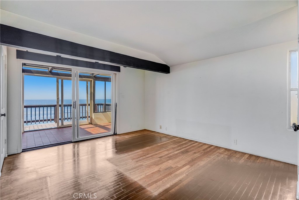1811 Ocean Way Laguna Beach, CA 92651 - Photo 10 of 28 a view of an empty room with wooden floor and a window