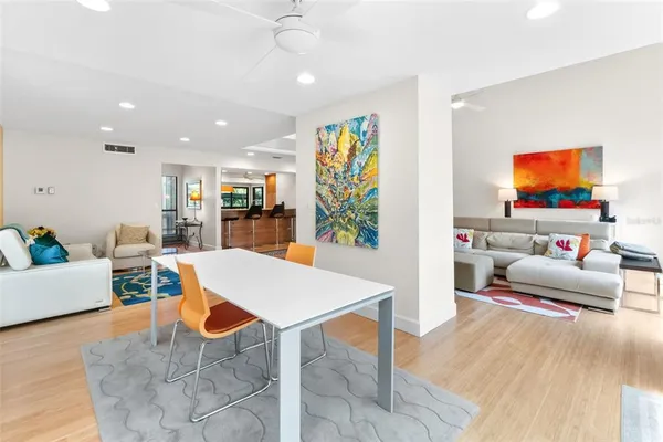 a large kitchen with stainless steel appliances granite countertop a stove and a sink