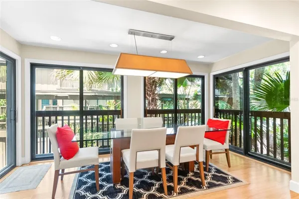 a kitchen with stainless steel appliances granite countertop a refrigerator a sink and a stove