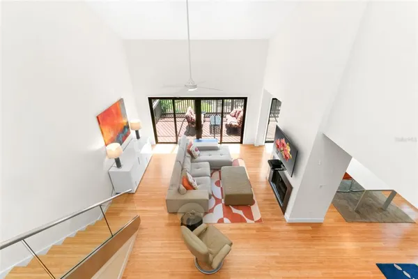 a bedroom with a large bed and a large window