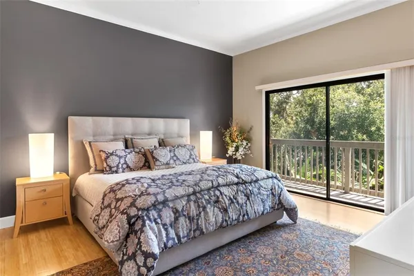 a bedroom with a bed and lamp