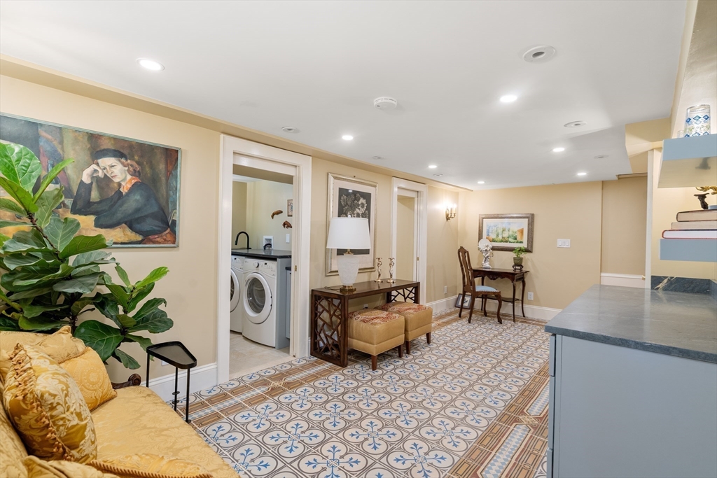 63 Crabtree Road Quincy, MA 02171 - Photo 16 of 41 a living room with furniture and a rug