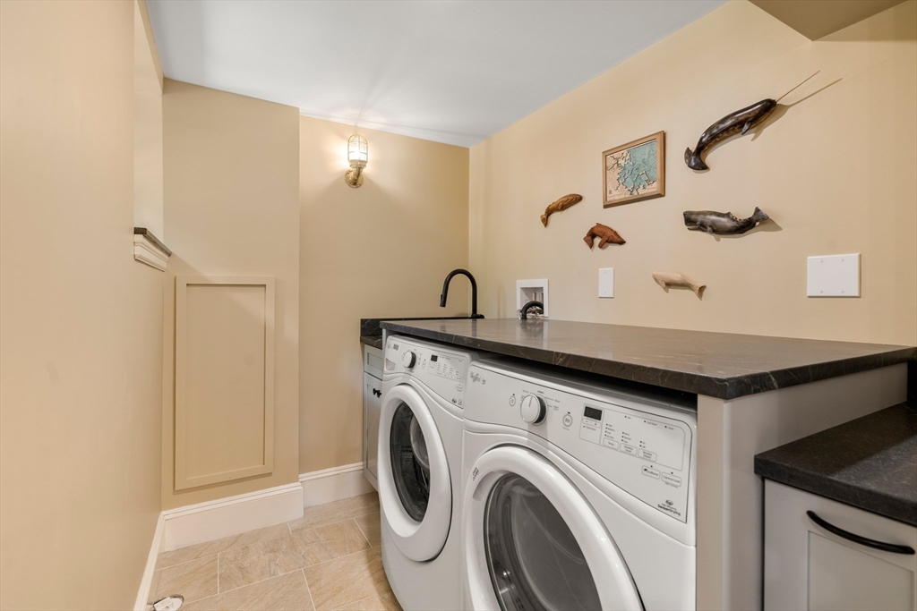 63 Crabtree Road Quincy, MA 02171 - Photo 17 of 41 a utility room with dryer and washer