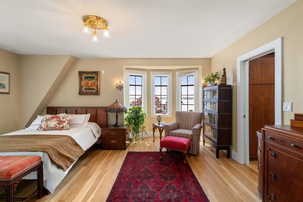 63 Crabtree Road Quincy, MA 02171 - Photo 19 of 41 a bedroom with a bed and wooden floor