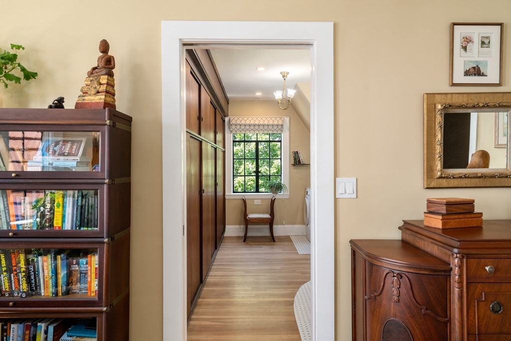 63 Crabtree Road Quincy, MA 02171 - Photo 21 of 41 a view of a bedroom with furniture and book shelf