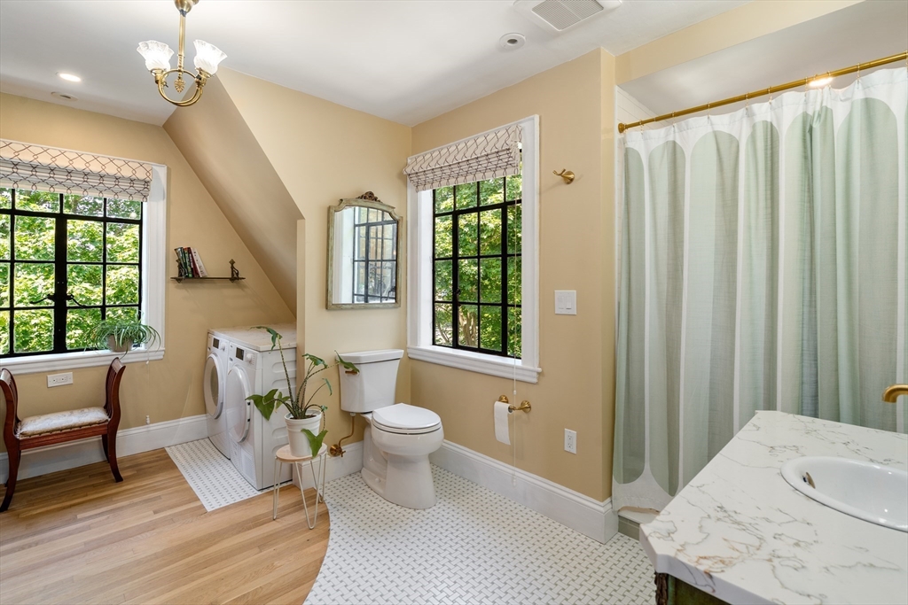 63 Crabtree Road Quincy, MA 02171 - Photo 22 of 41 a living room with furniture a window and a potted plant