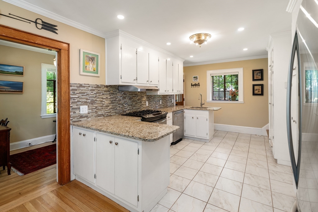 63 Crabtree Road Quincy, MA 02171 - Photo 27 of 41 a kitchen with stainless steel appliances granite countertop a sink and cabinets