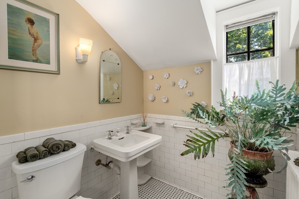 63 Crabtree Road Quincy, MA 02171 - Photo 34 of 41 a bathroom with a sink and a mirror