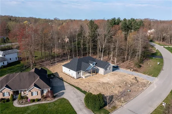 a view of a backyard with sitting area