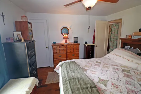 a bedroom with a bed and a dresser
