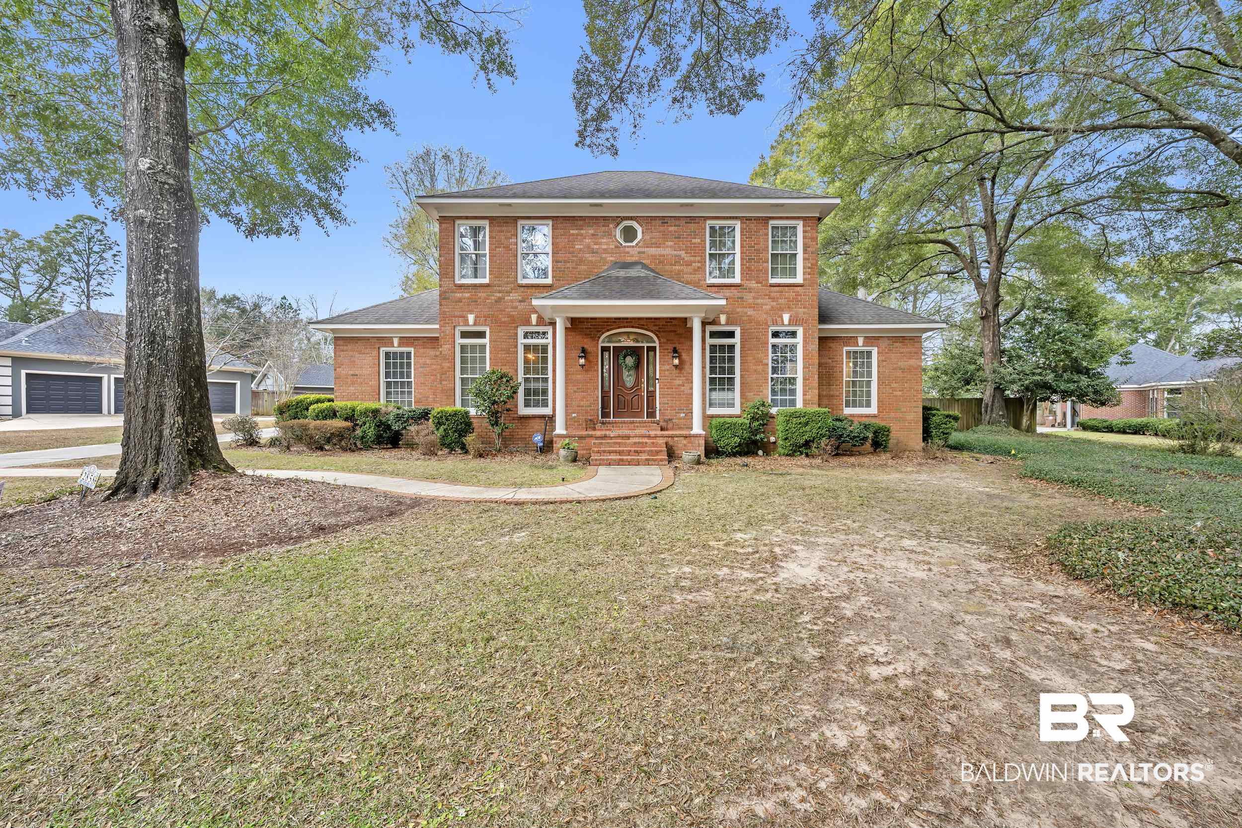 2858 Postoak Circle Mobile, AL 36693 - Photo 6 of 32 Colonial home featuring brick siding and a front yard