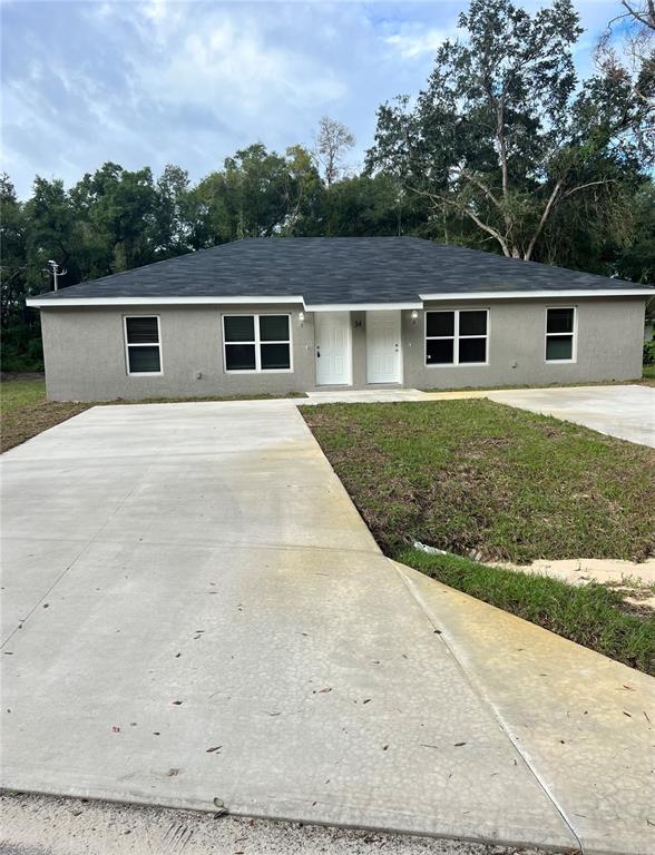 34 Locust Run, Unit 2 Ocala, FL 34472 - Photo 1 of 1 front view of a house with a yard