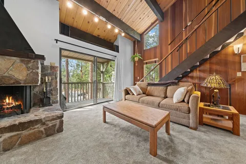 a balcony with furniture and a fireplace