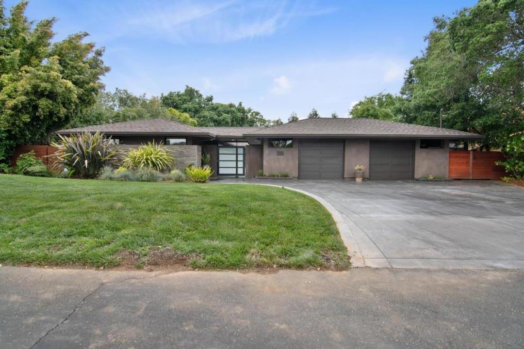 a front view of a house with garden