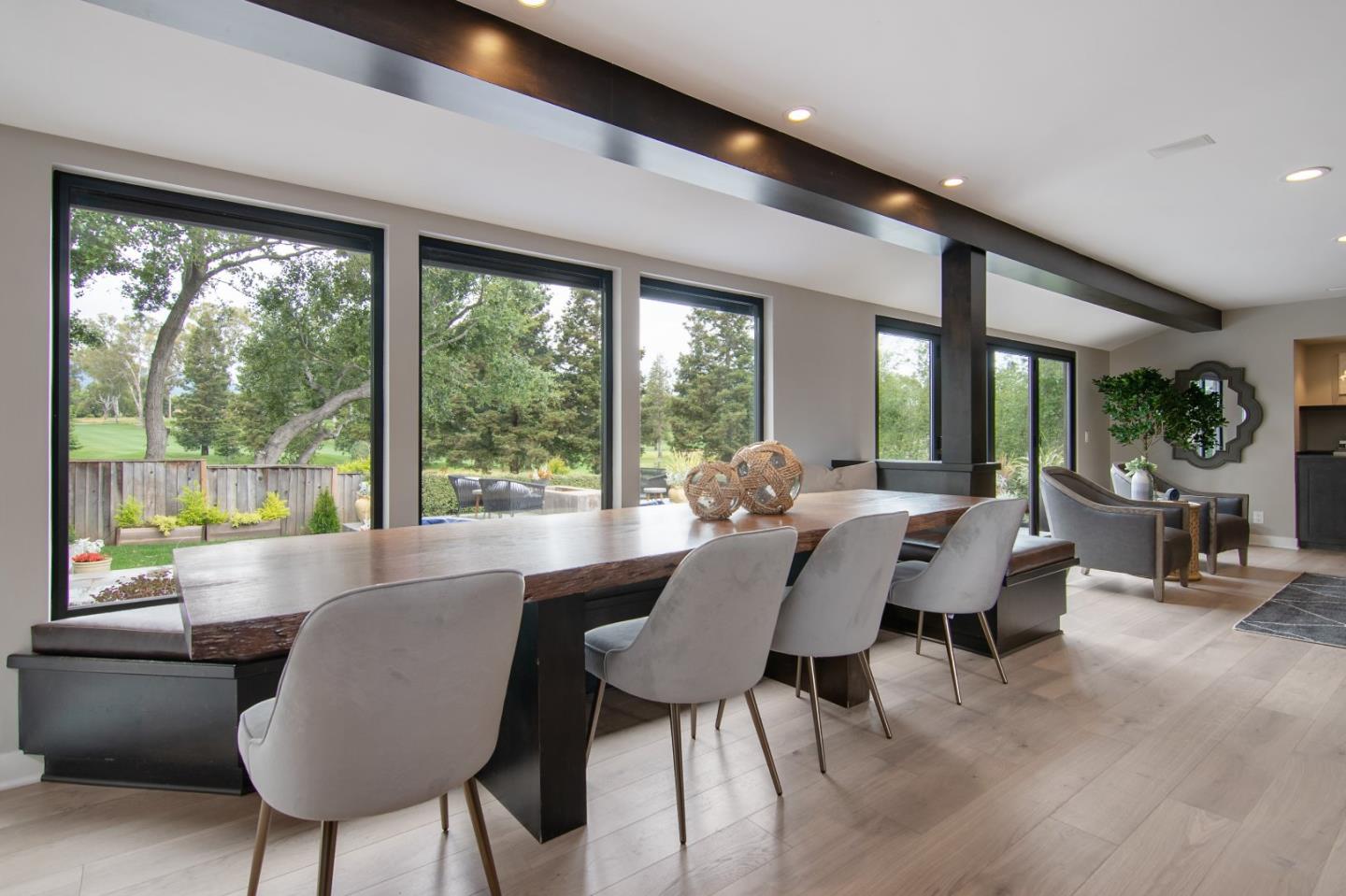 14973 Natalye Road Monte Sereno, CA 95030 - Photo 12 of 31 a dining room with furniture a chandelier and wooden floor