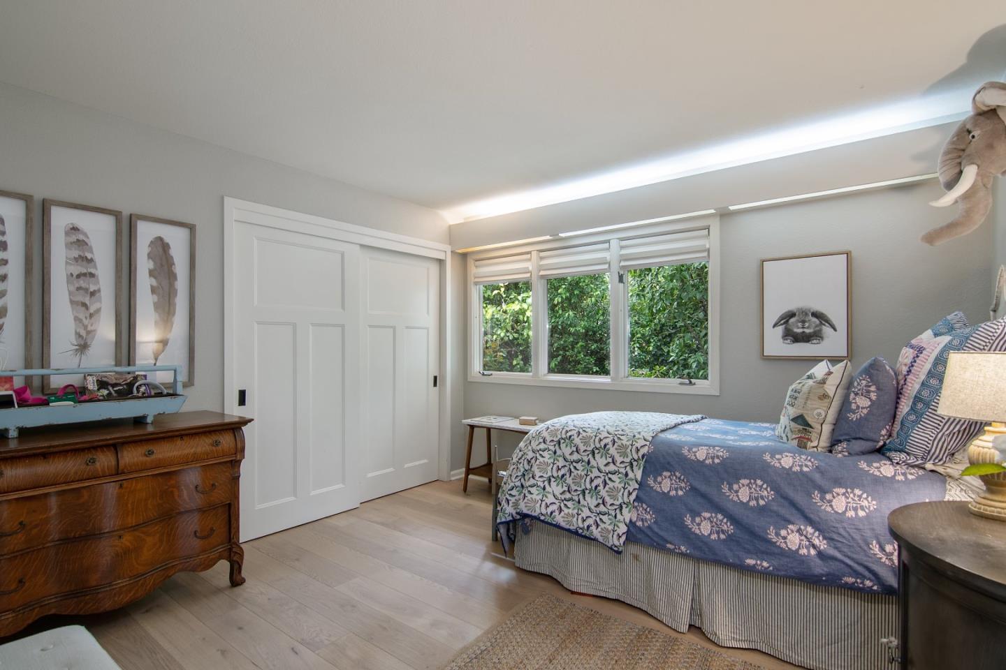 14973 Natalye Road Monte Sereno, CA 95030 - Photo 16 of 31 a bedroom with a bed and window