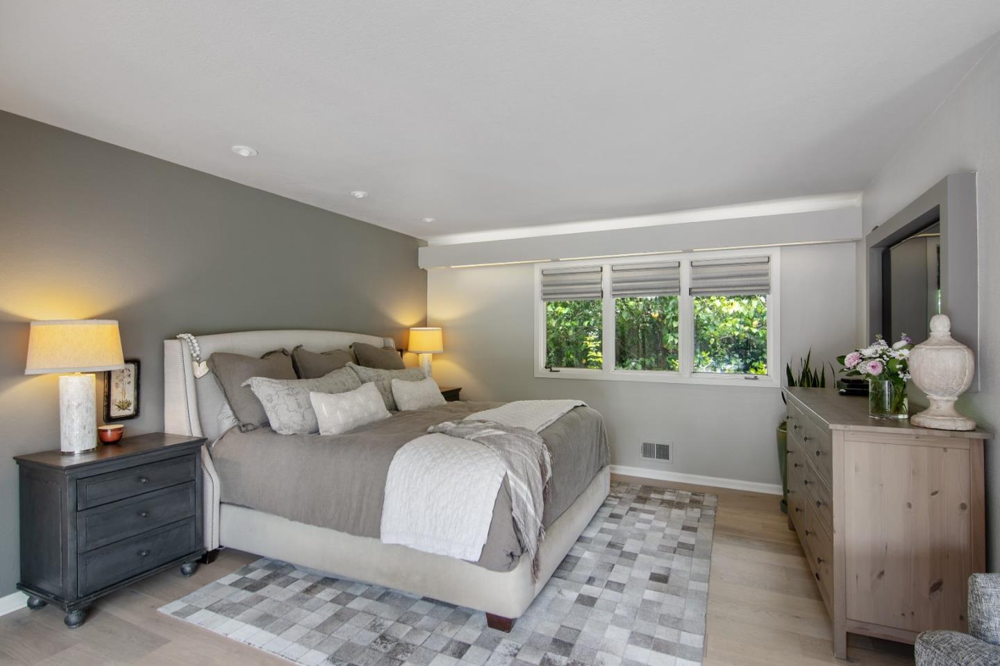 14973 Natalye Road Monte Sereno, CA 95030 - Photo 18 of 31 a bedroom with a bed and large window