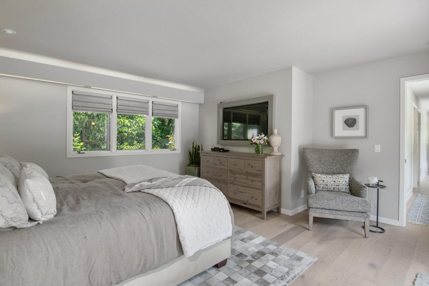 14973 Natalye Road Monte Sereno, CA 95030 - Photo 19 of 31 a bedroom with a bed and a television