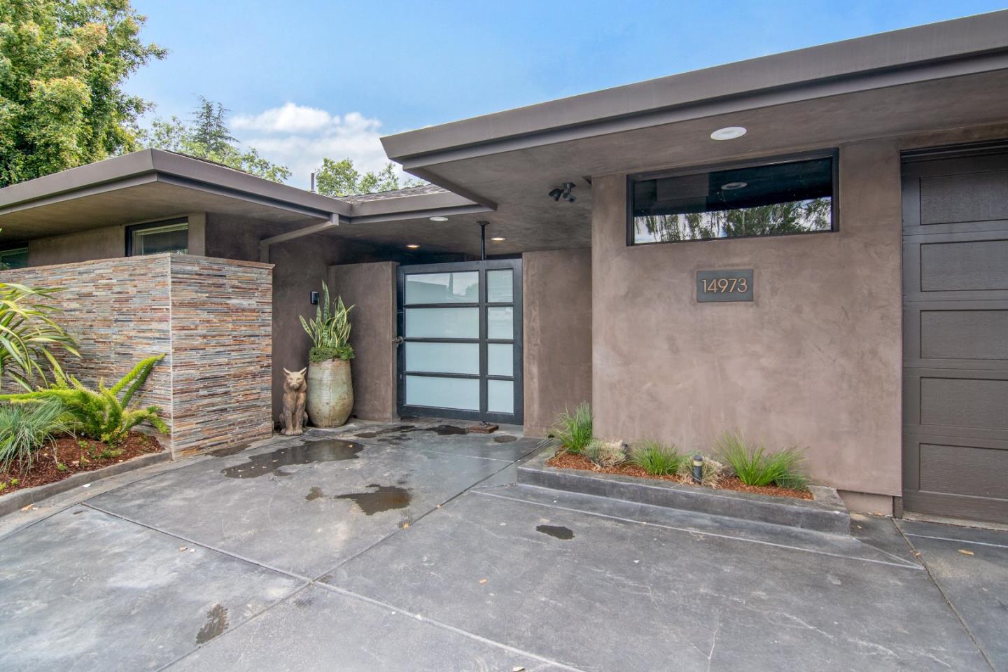 14973 Natalye Road Monte Sereno, CA 95030 - Photo 4 of 31 a front view of a house with a garage
