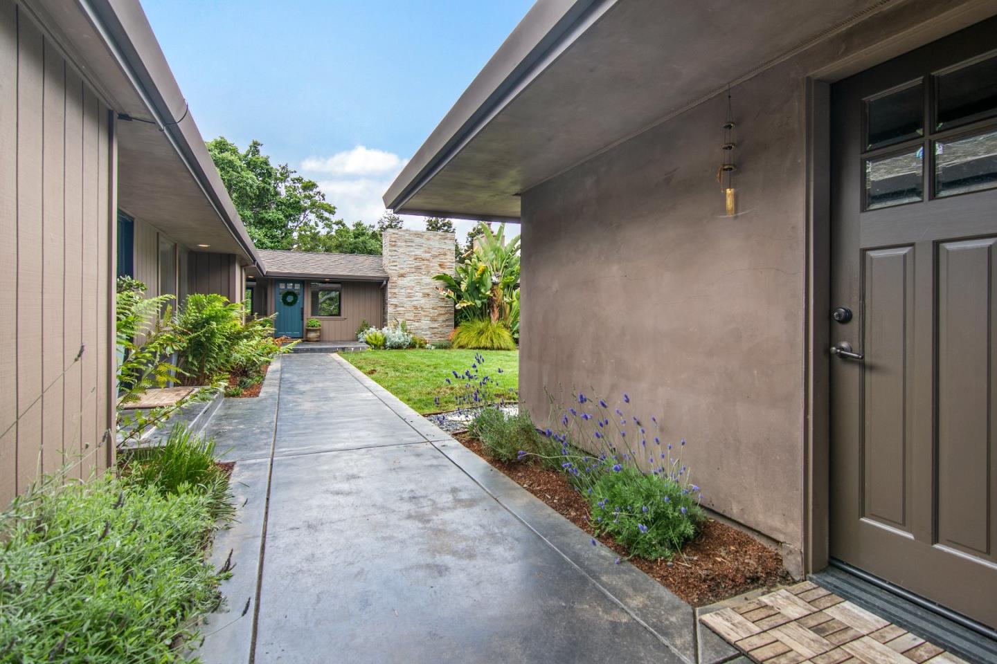 14973 Natalye Road Monte Sereno, CA 95030 - Photo 5 of 31 a view of a pathway with house and garden