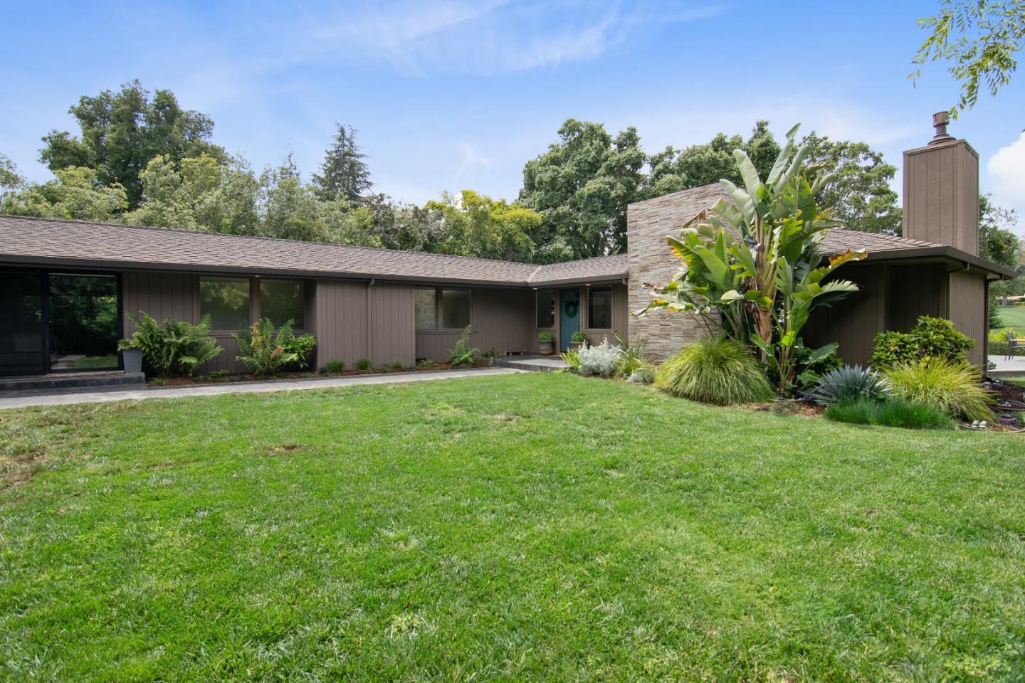 14973 Natalye Road Monte Sereno, CA 95030 - Photo 7 of 31 a front view of a house with garden