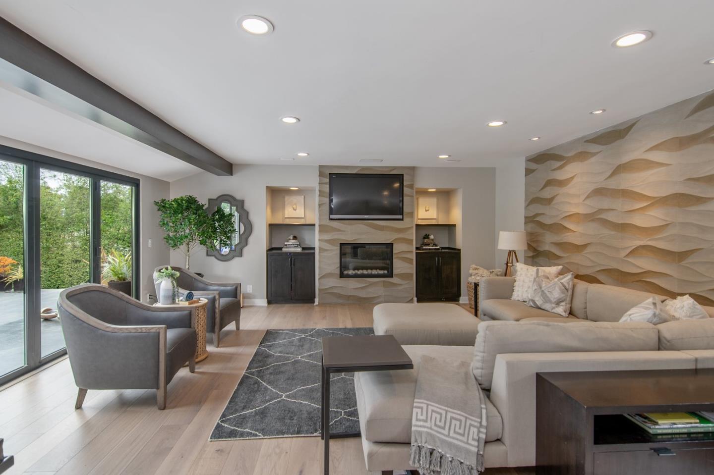 14973 Natalye Road Monte Sereno, CA 95030 - Photo 8 of 31 a living room with furniture large window and a fireplace