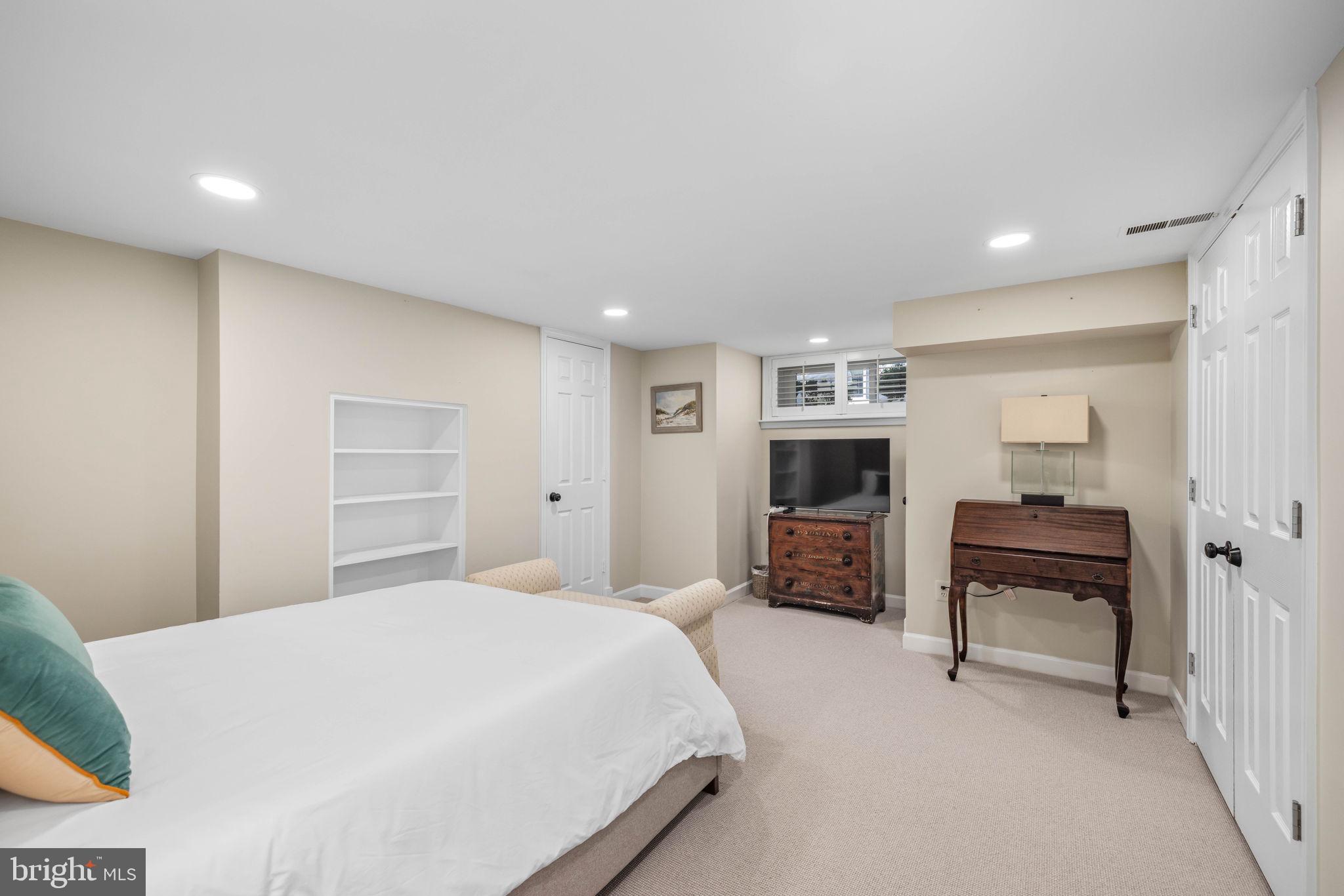3408 Dent Place Northwest Washington, DC 20007 - Photo 15 of 17 a bedroom with a bed and a television