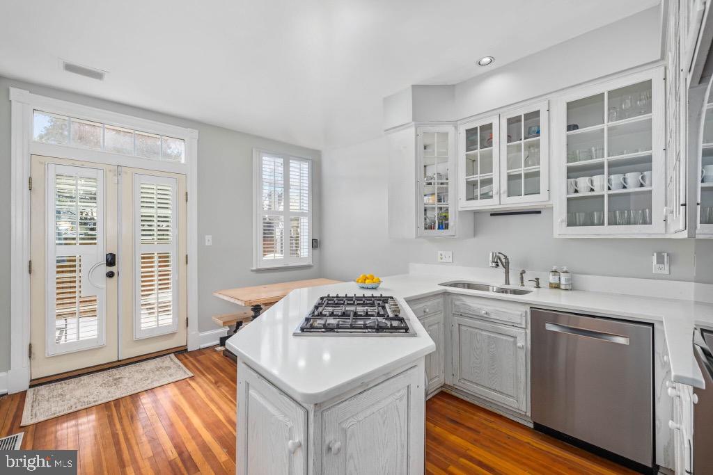3408 Dent Place Northwest Washington, DC 20007 - Photo 3 of 17 a kitchen with a sink stove and cabinets