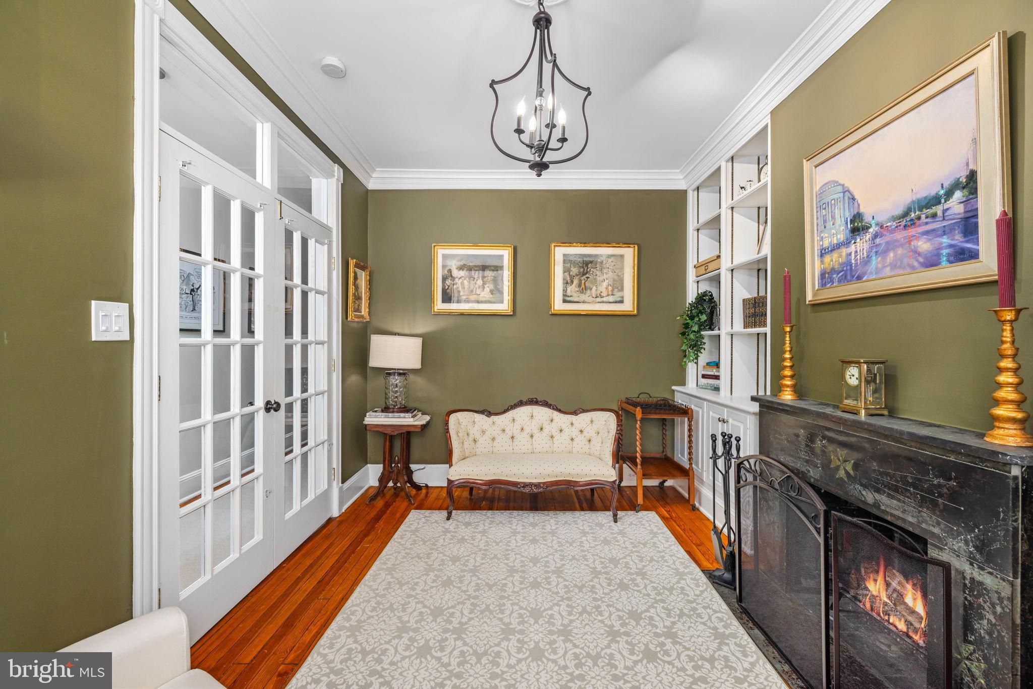 3408 Dent Place Northwest Washington, DC 20007 - Photo 5 of 17 a bedroom with furniture and a chandelier