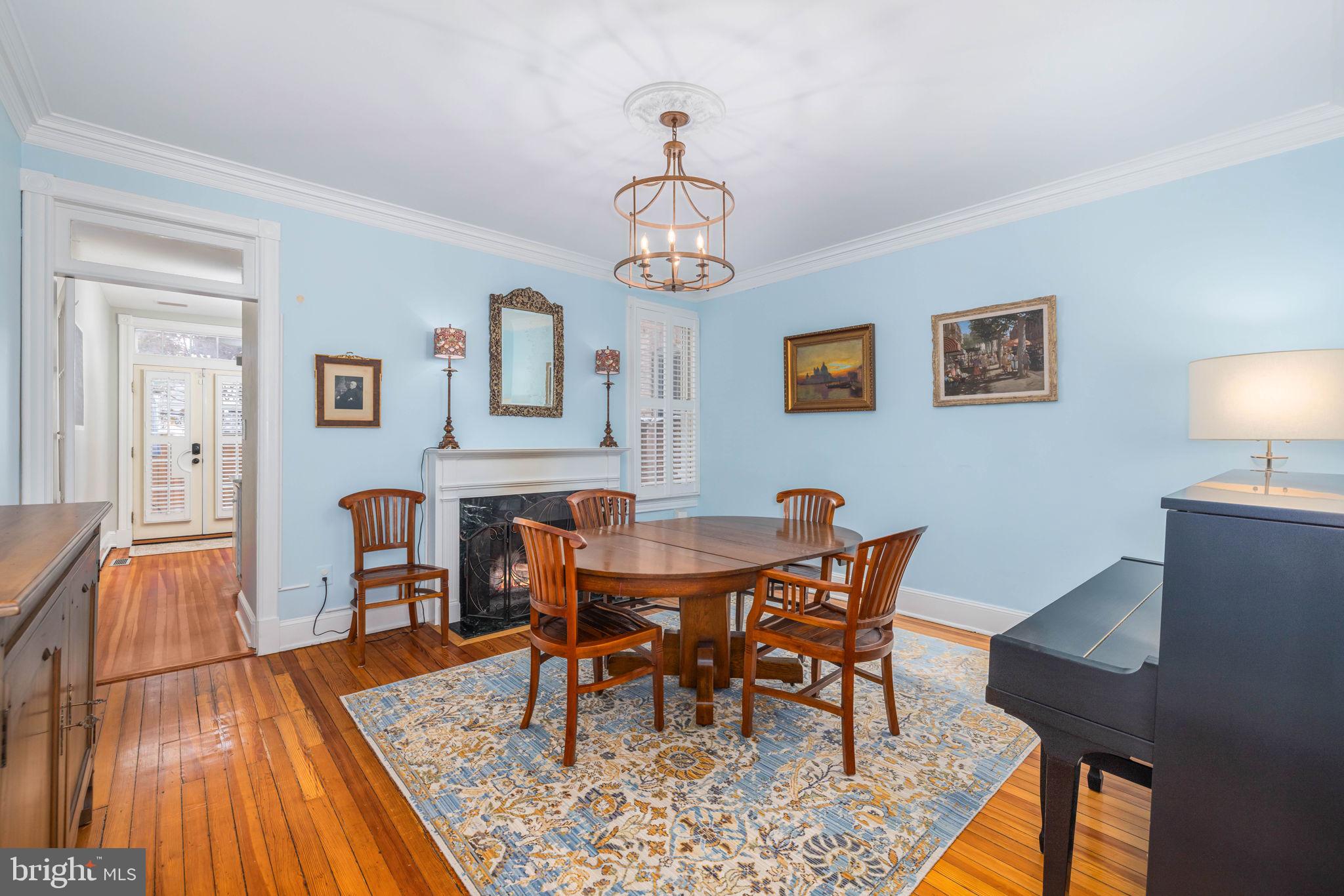 3408 Dent Place Northwest Washington, DC 20007 - Photo 7 of 17 a view of a dining room with furniture wooden floor and a chandelier